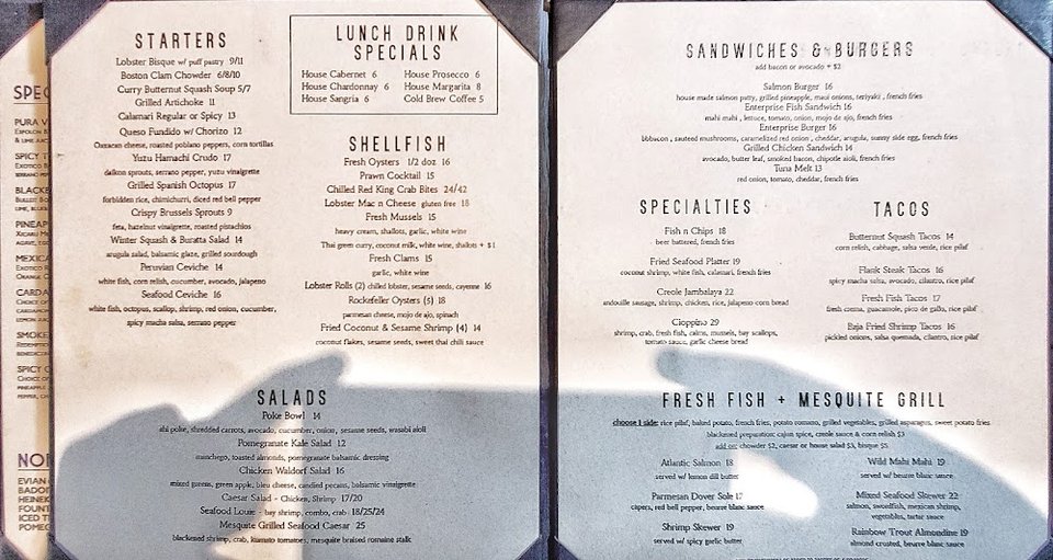 Small plates and cocktails on a menu.